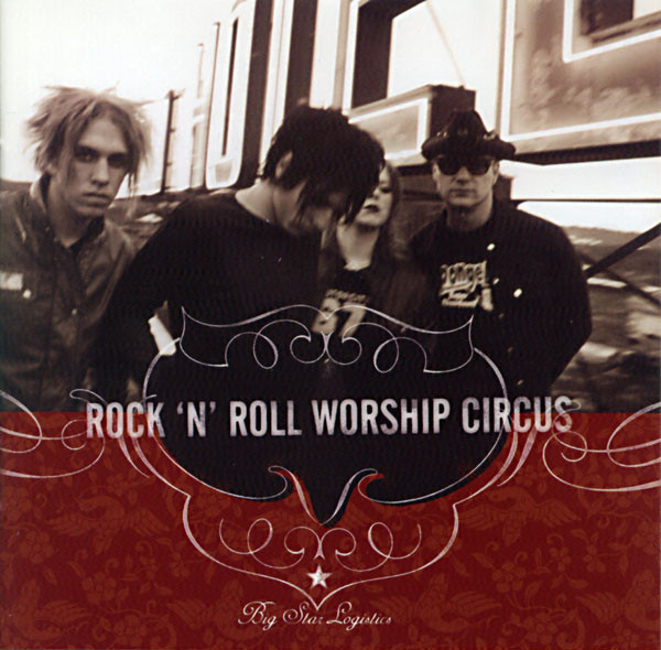 Album Art of The Rock 'N' Roll Worship Circus's Big Star Logistics album - A black-and-white, somewhat blurry photo of four young people in hoodies and T-shirts with rather crazy looks standing on top of a building with a large neon 'Hotel' sign behind them. The picture is a bit blurry with motion and and the bottom third is covered by a dark red background and a decorative line around the band's name in large, white block letters. At the very bottom in smaller, more decorative font is the album title and a small white star is right above it.
