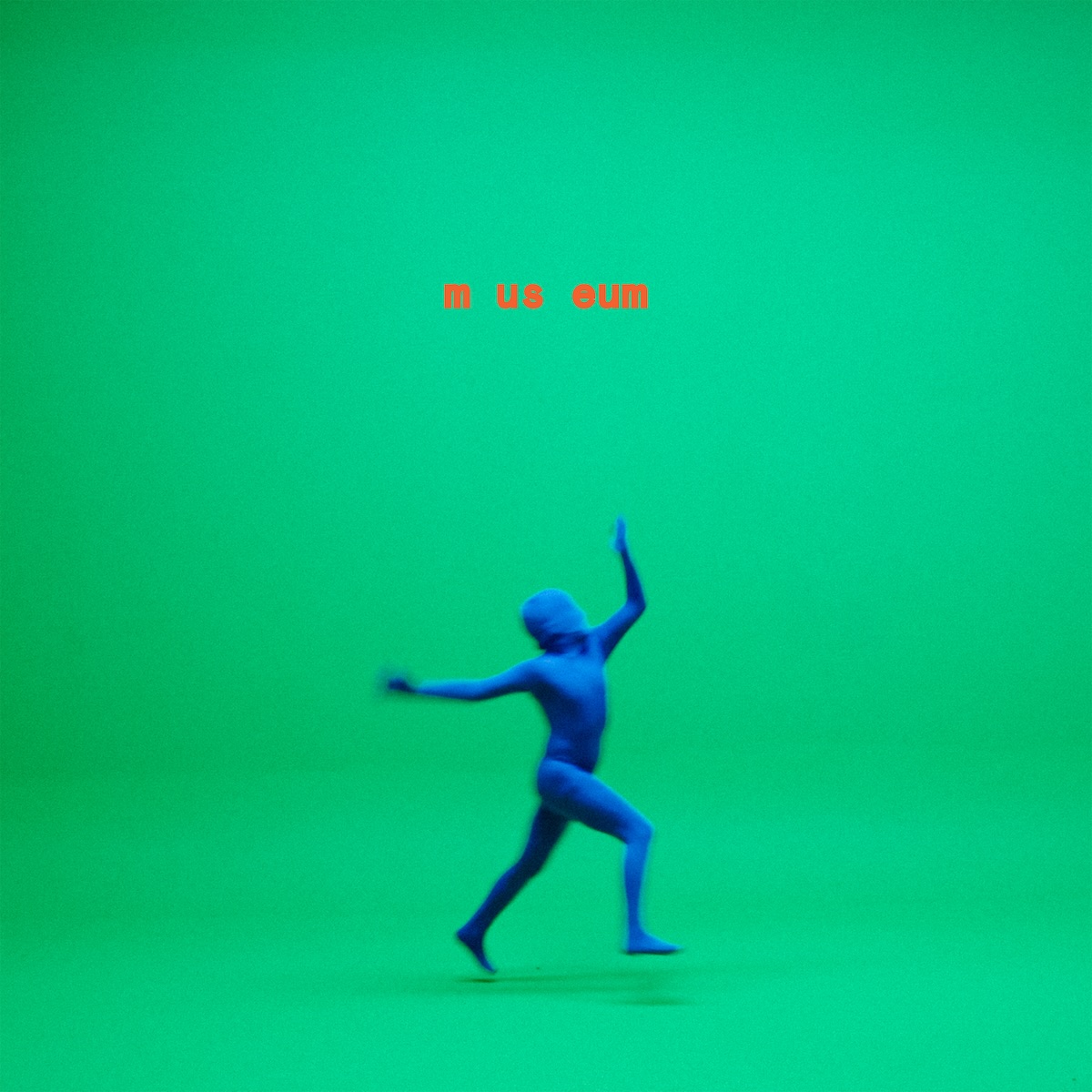 Album Art of Citizens's Museum album - A photo of a large green screen room with both green walls and a green floor and no real easy-to-spot place wher the wall and ends and floor starts. On the floor is a person covered from head to toe in some sort of blue skin-tight suit. They are caught in motion in the middle of the photo, it looks like dancing or something, and both of their feet are off the floor because there's a shadow below them.</body></html>