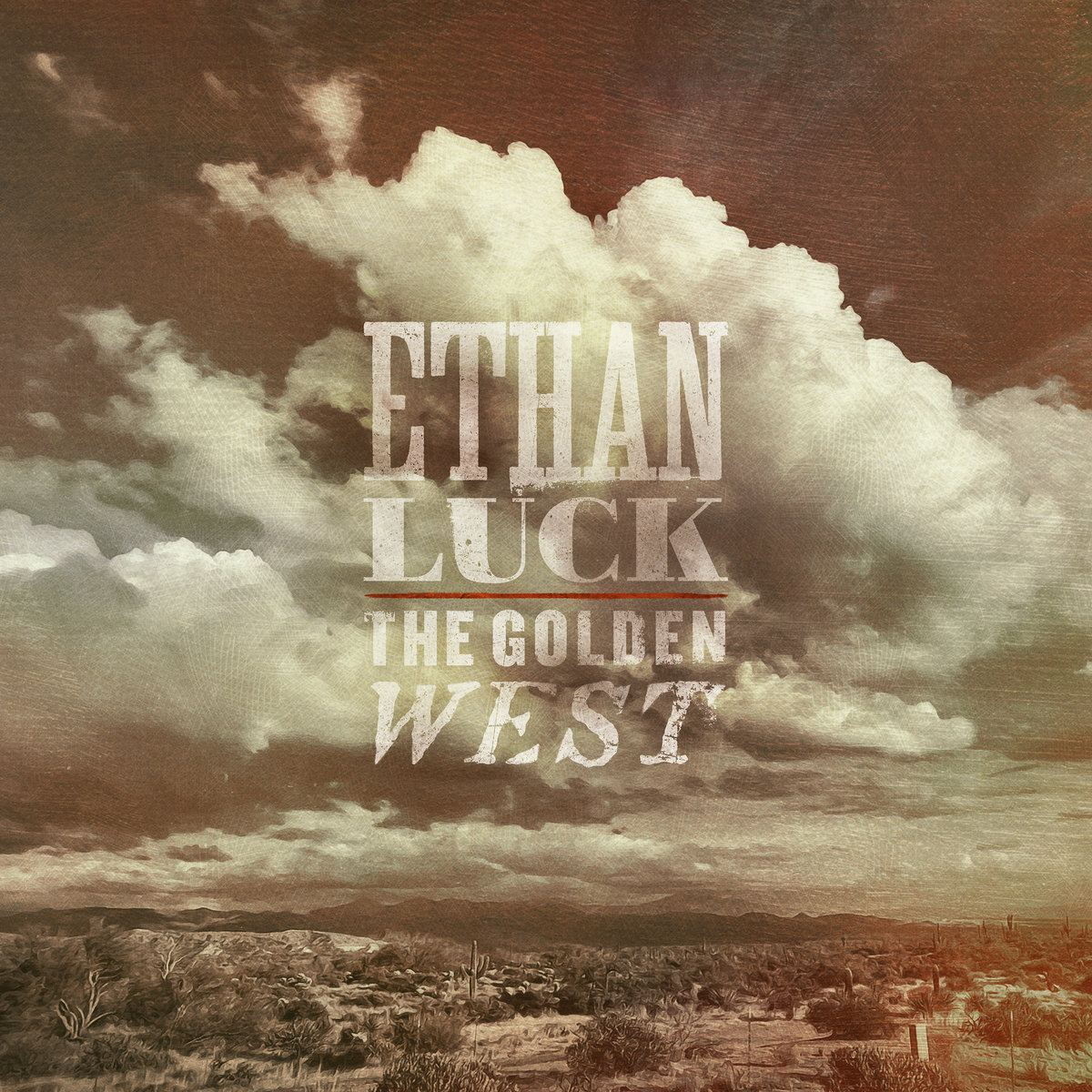Album Art of Ethan Luck's The Golden West album - A photo of a western landscape at the bottom and the clouds above. The bottom 15-20% of the photo is the ground and it's a desert landscape with lots of dirt, bushes and a few cacti, with large hills/mountains off along the skyline. Clouds take up much of the photo, though a sky can be seen through the clouds. The whole photo is tinted brown/gray, so there's very little blue in the sky. The artist's name is printed in large type semi-transparently over the sky, then a red-orange line and the album title in slightly smaller, also-transparent print.