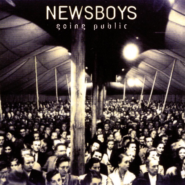 Album Art of Newsboys's Going Public album - A black and white photo of thousands of people standing inside a very large tent the size of a gymnasium or larger. They are facing the camera and looking a bit off to the right of the camera. There seems to be lights set up in the ceiling of the tent to light up the scene and there are a bunch of support poles that break up the sea of people a bit.</body></html>