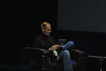 Steve in a chair with the Apple iPad